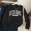 16d75973-f24f-4eda-b78e-3bcca9fad2a6-1 Sweat-shirt à col rond imprimé graphique Outer Banks Caroline du Nord pour femmes,(TEMU)